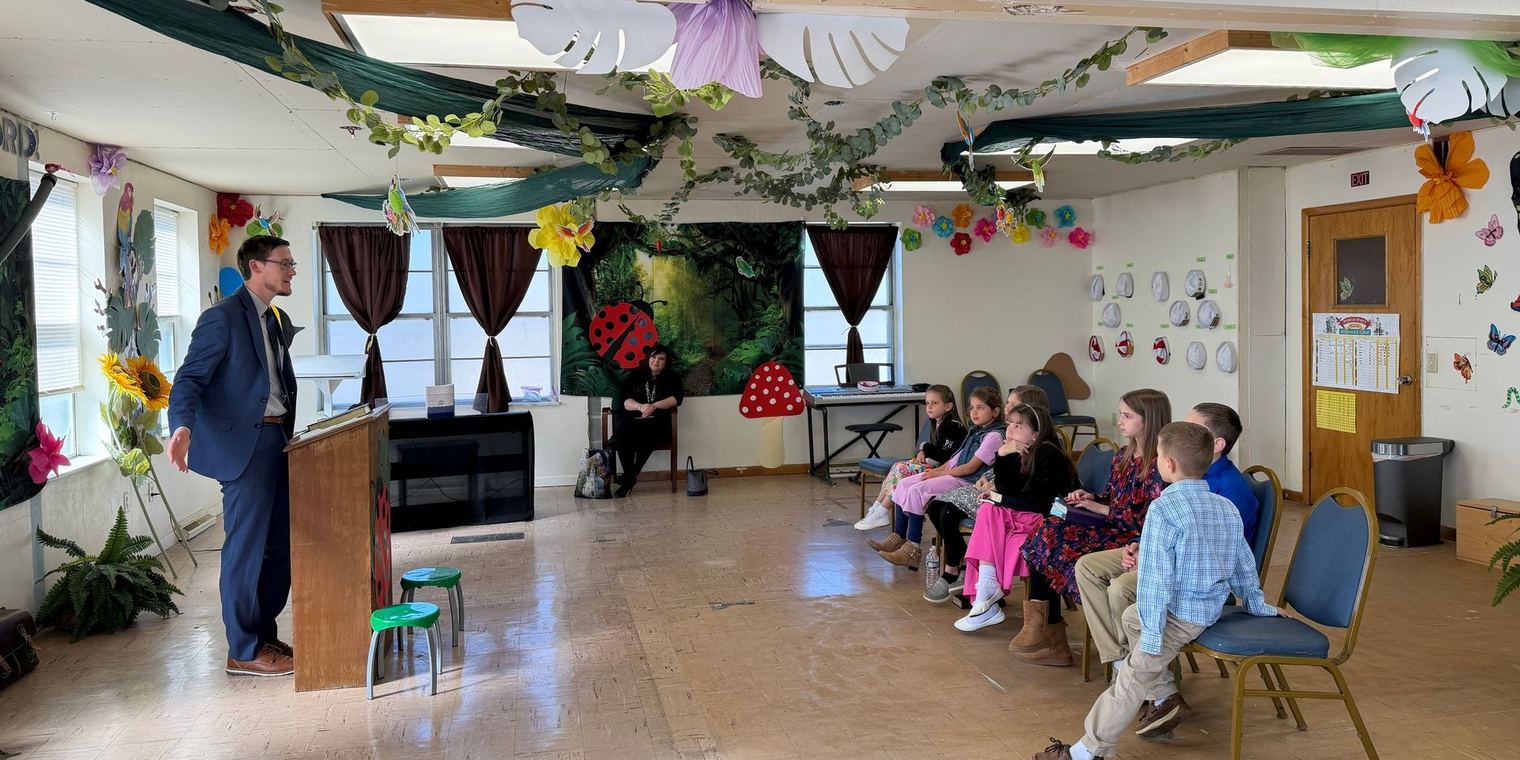 Children in the Junior Church room listening to a teacher