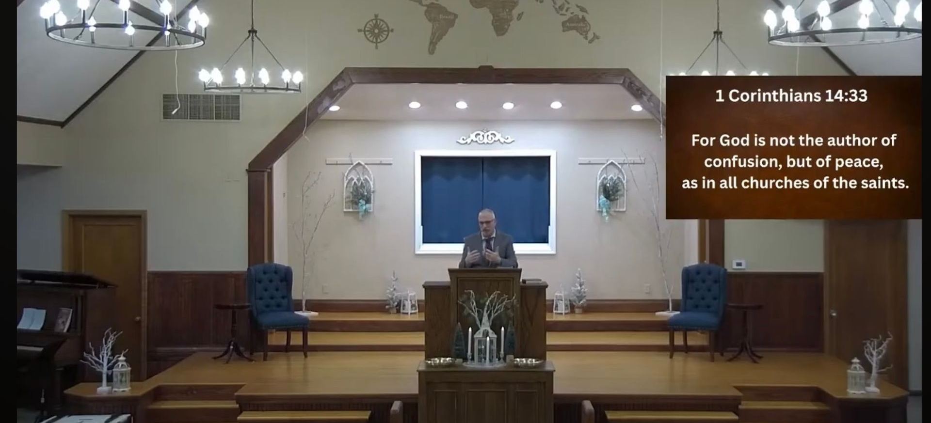 The sanctuary during a Sunday service, with Pastor Leonard preaching from the pulpit